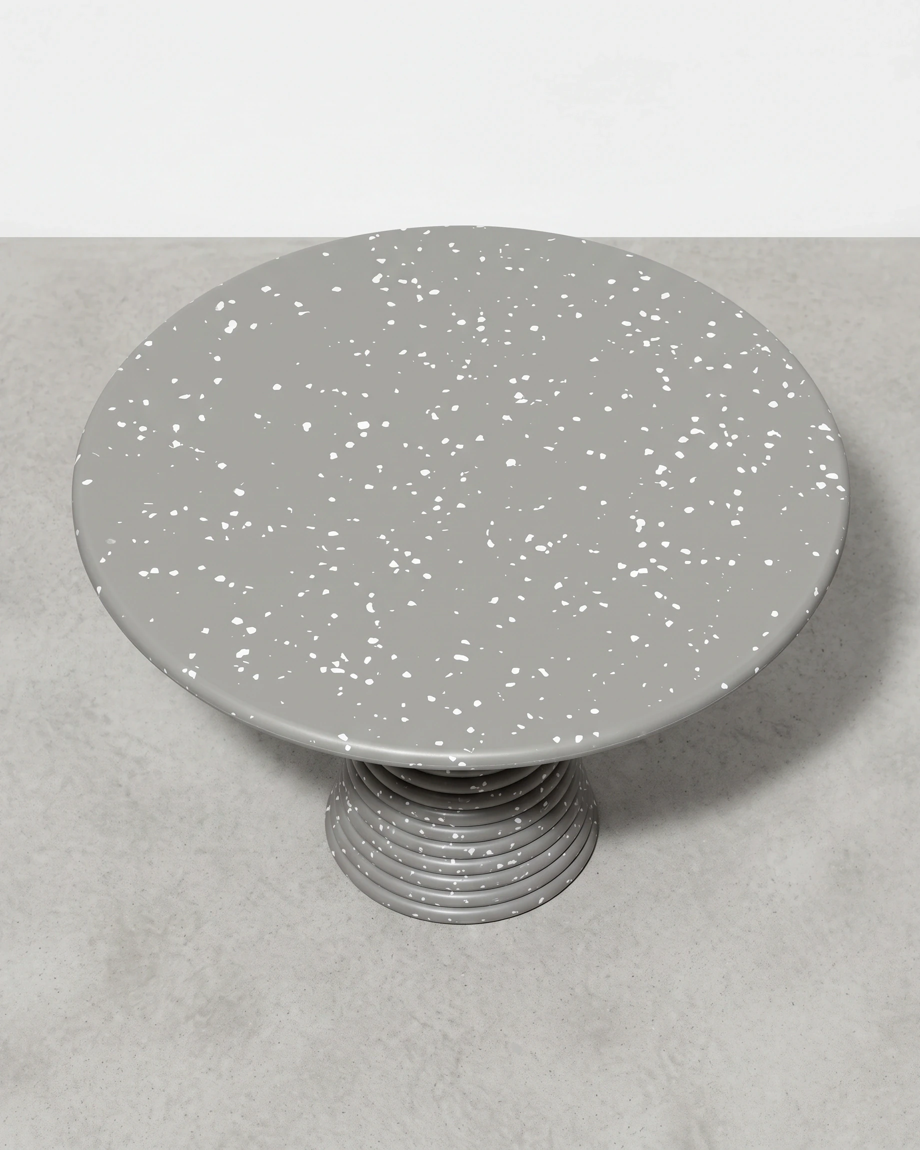 Weaver, stacked-disc table Ø80 × 52, cone leg, grey, white flecks: top view