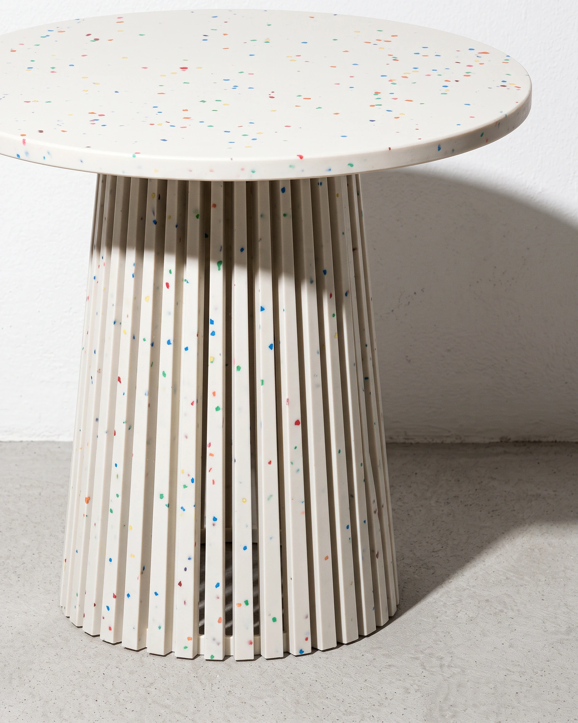 Sculptor, cone-leg table Ø60 × 55, white, colour flecks: front right view