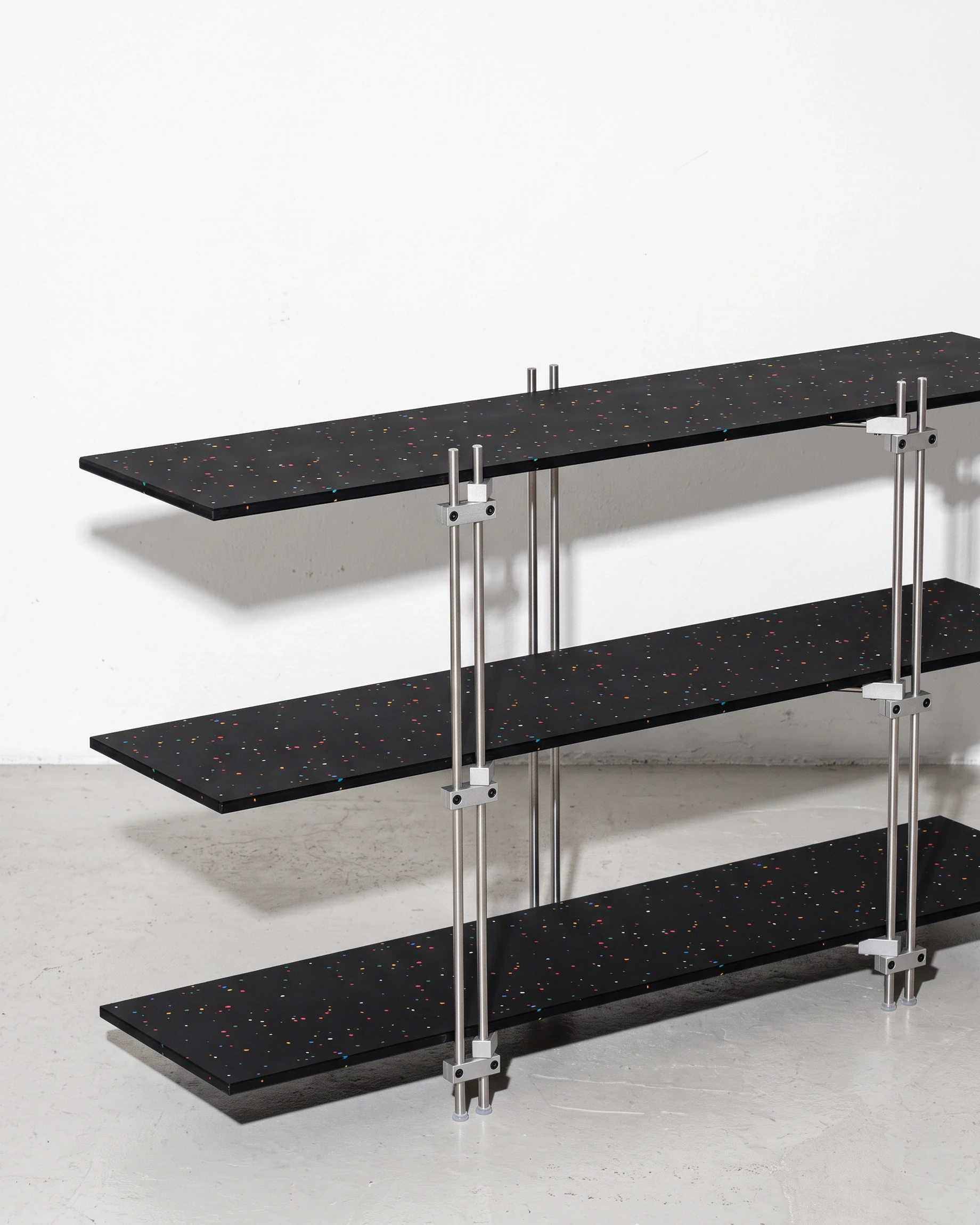 Doorman, tiered console 1200, black, colour flecks: front left view