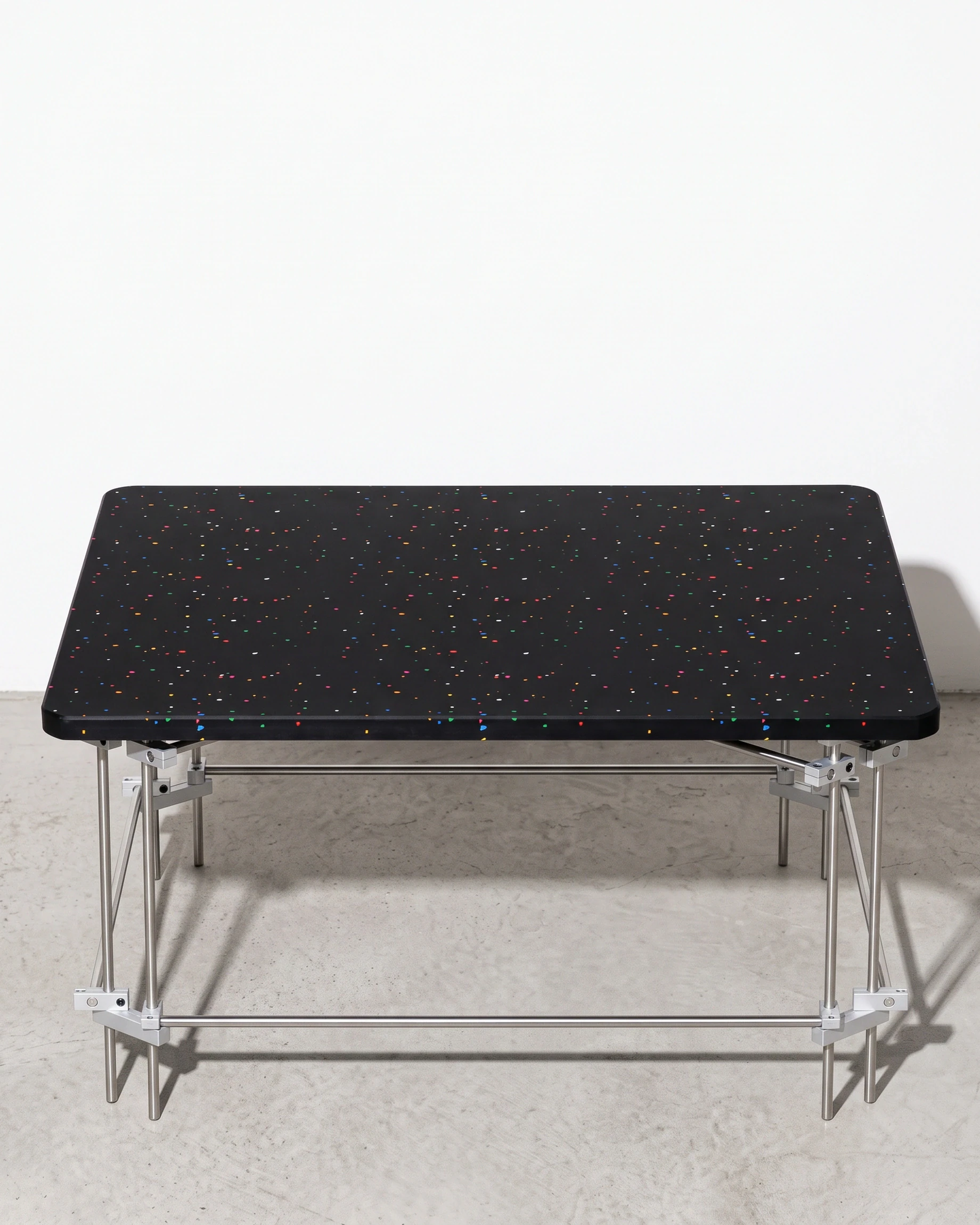 Chess Player, coffee table 80 × 80, black, colour flecks: front view